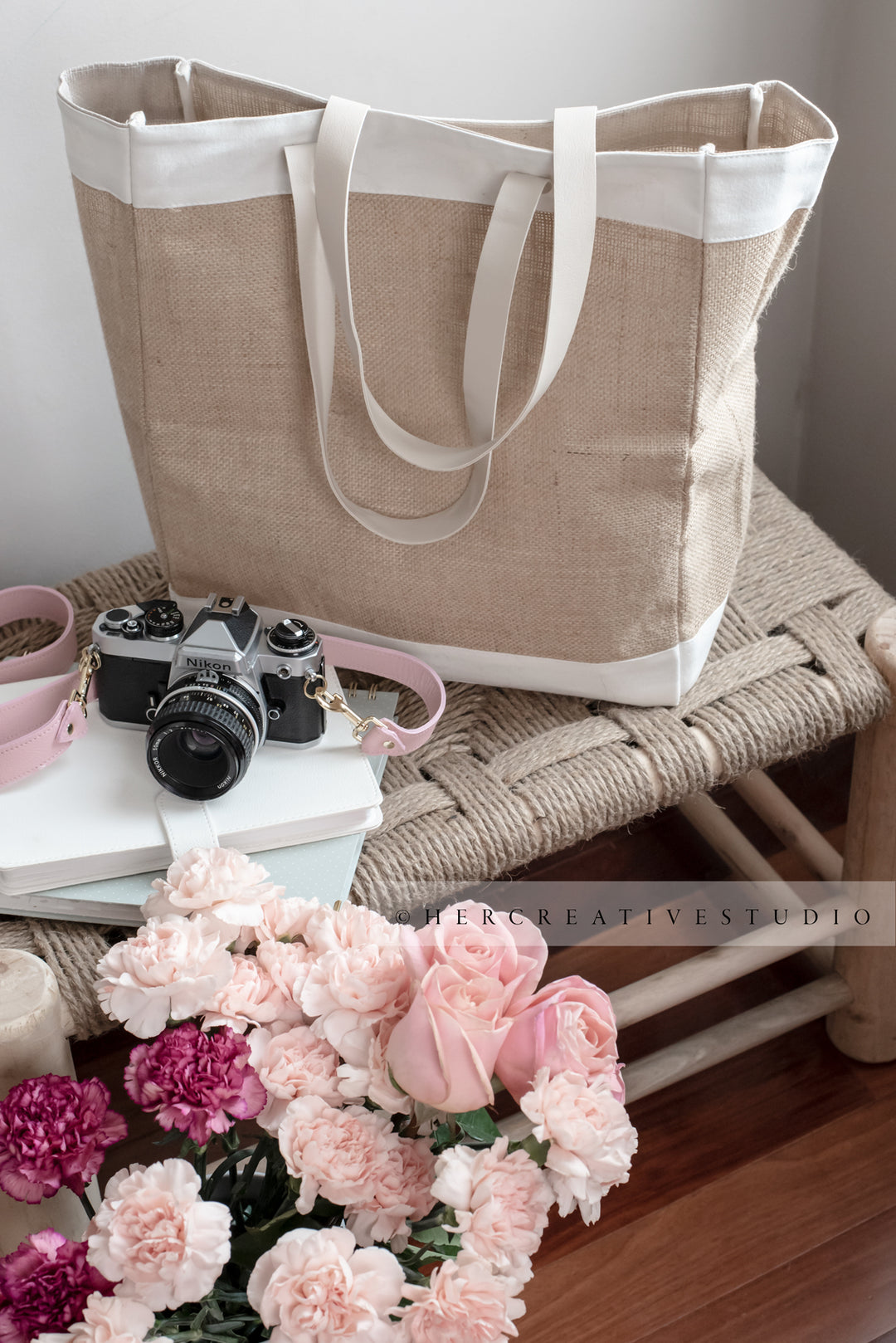Tote, Camera and Flowers on Bench, Styled Stock Image
