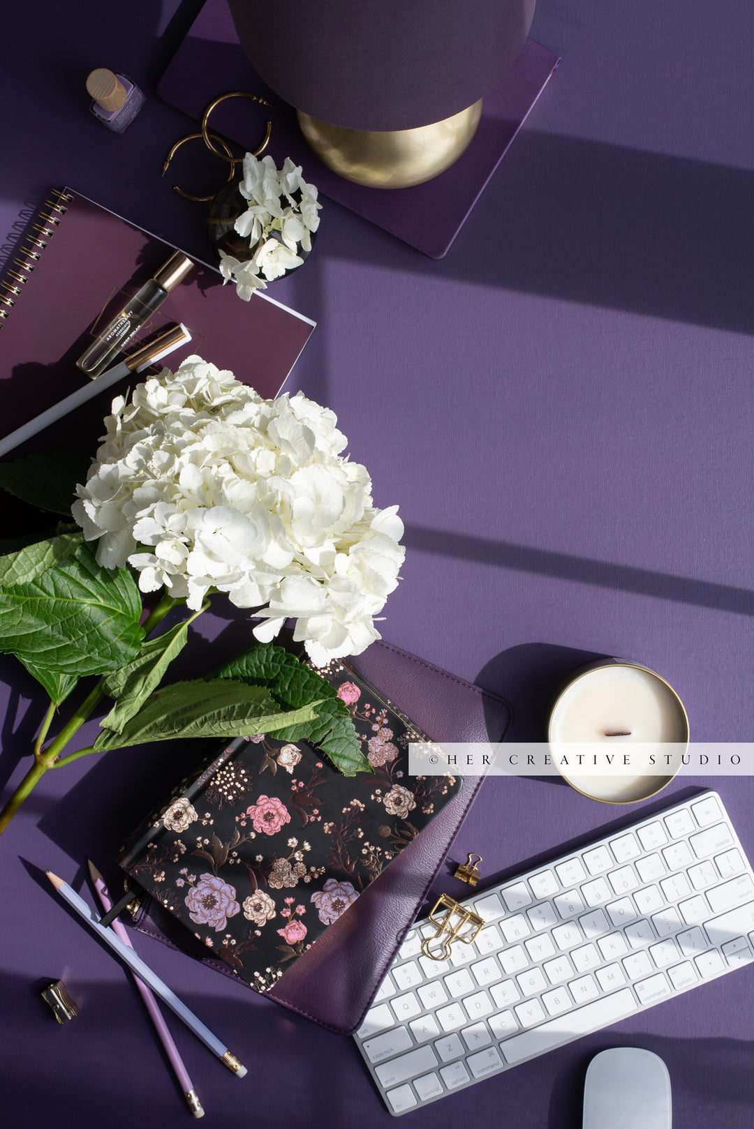 Purple Workspace With White Florals, Stock Photo.