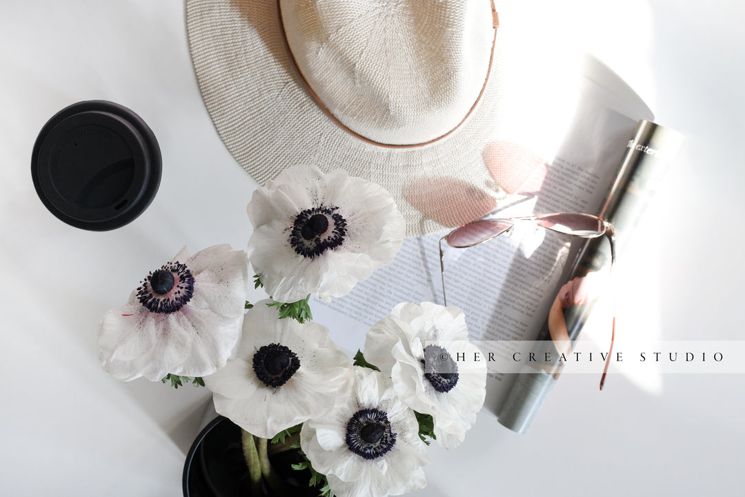 Anemone Flowers with Coffee & Hat. Styled Image.