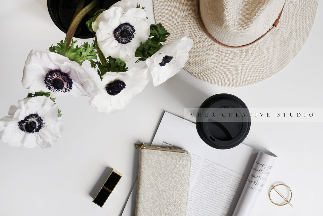 Coffee & Anemone Flowers on Workspace. Styled Image.