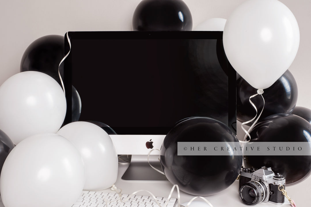 White and Black Balloons on Workspace, Styled Image