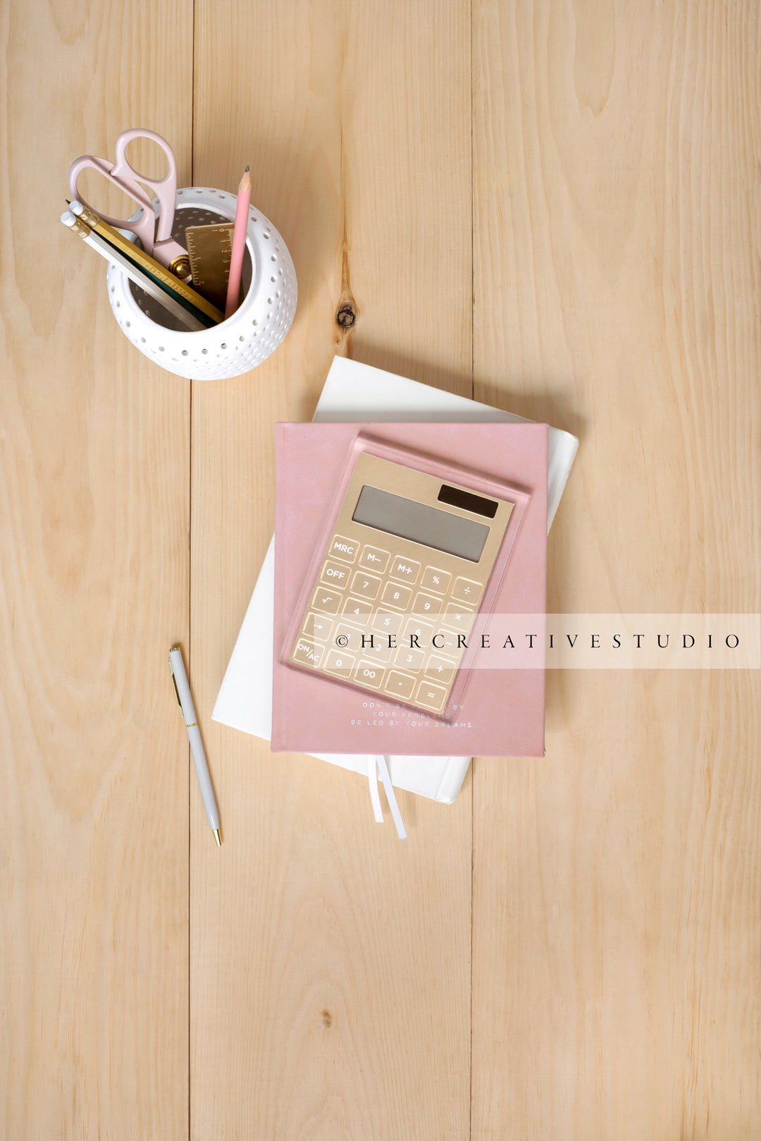Calculator & Pencil Holder on Light Wood Floor, Styled Stock Image