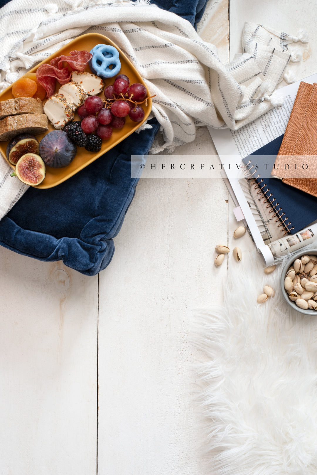 Cheese Plate & Notebooks on Wood Background