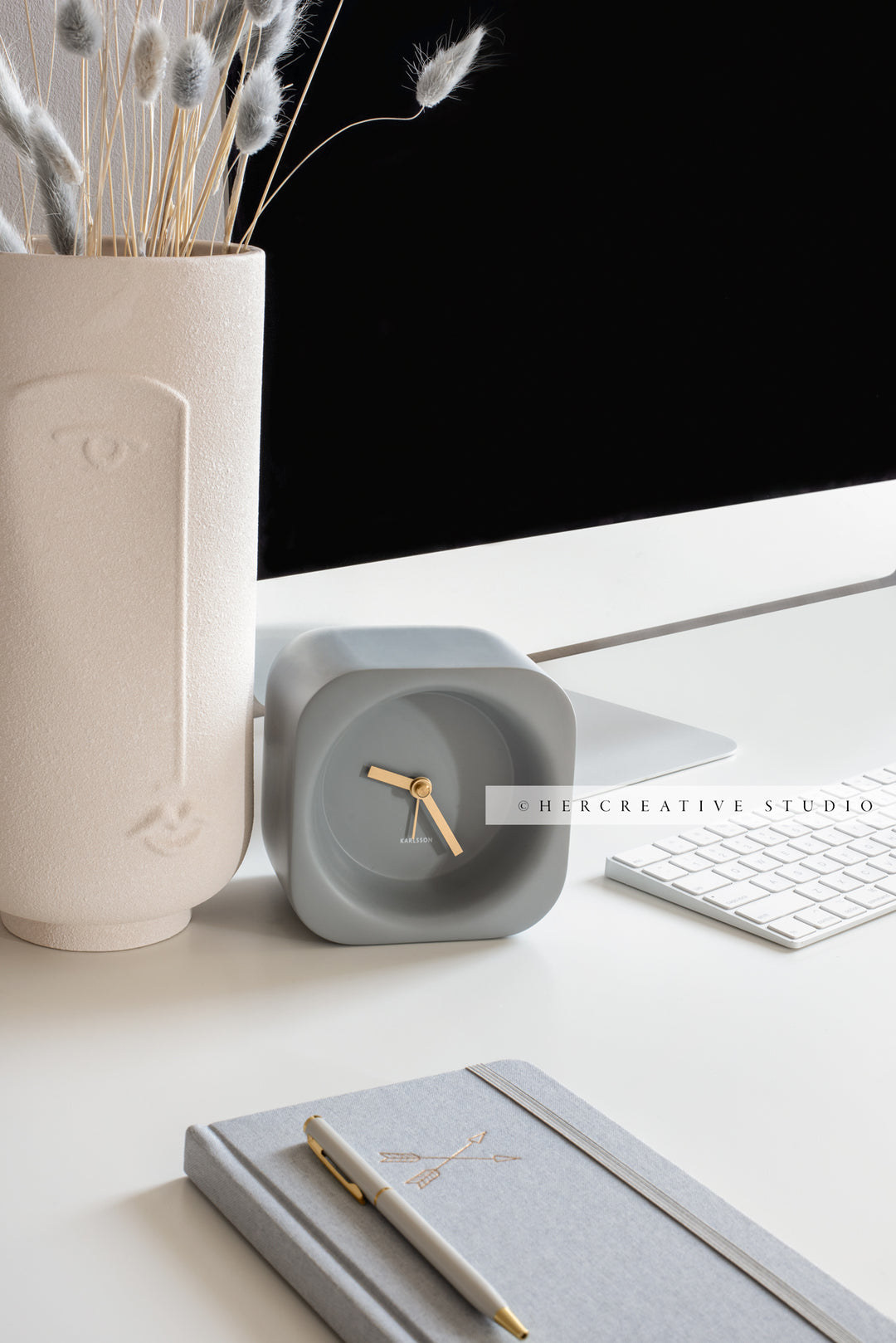 Clock and Notebook on Grey Workspace. Stock Image
