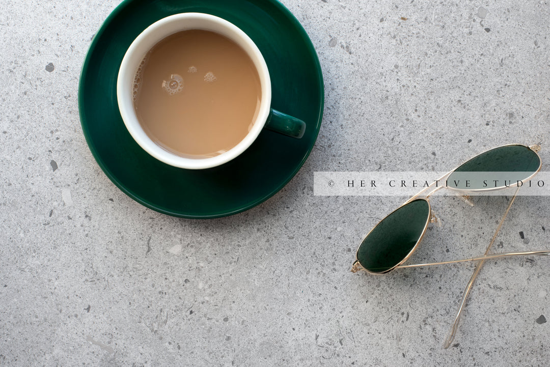 Sunglasses & Coffee on Granite Background. Digital Stock Image