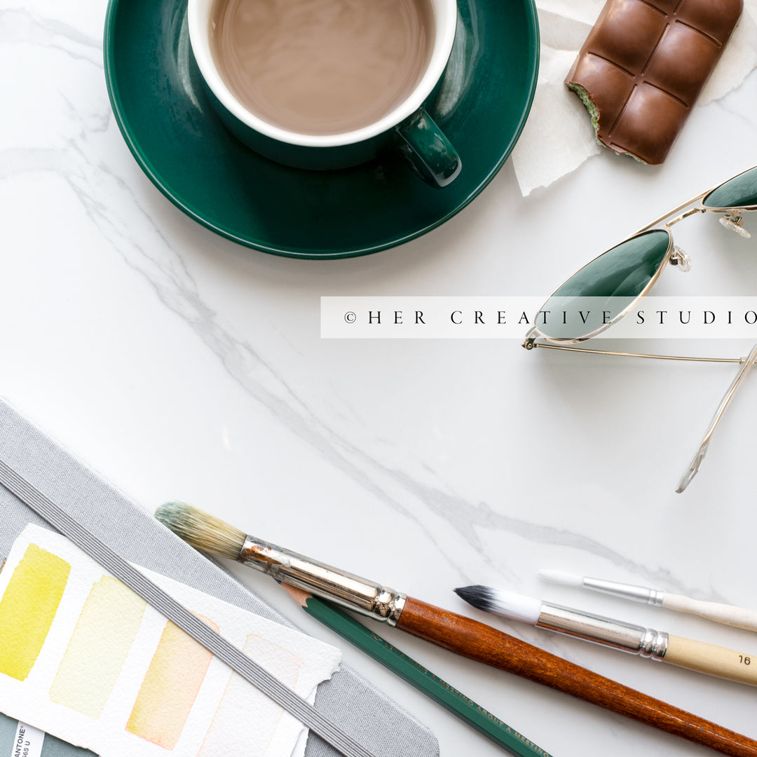 Coffee & Paintbrushes on Marble Background. Styled Stock Image