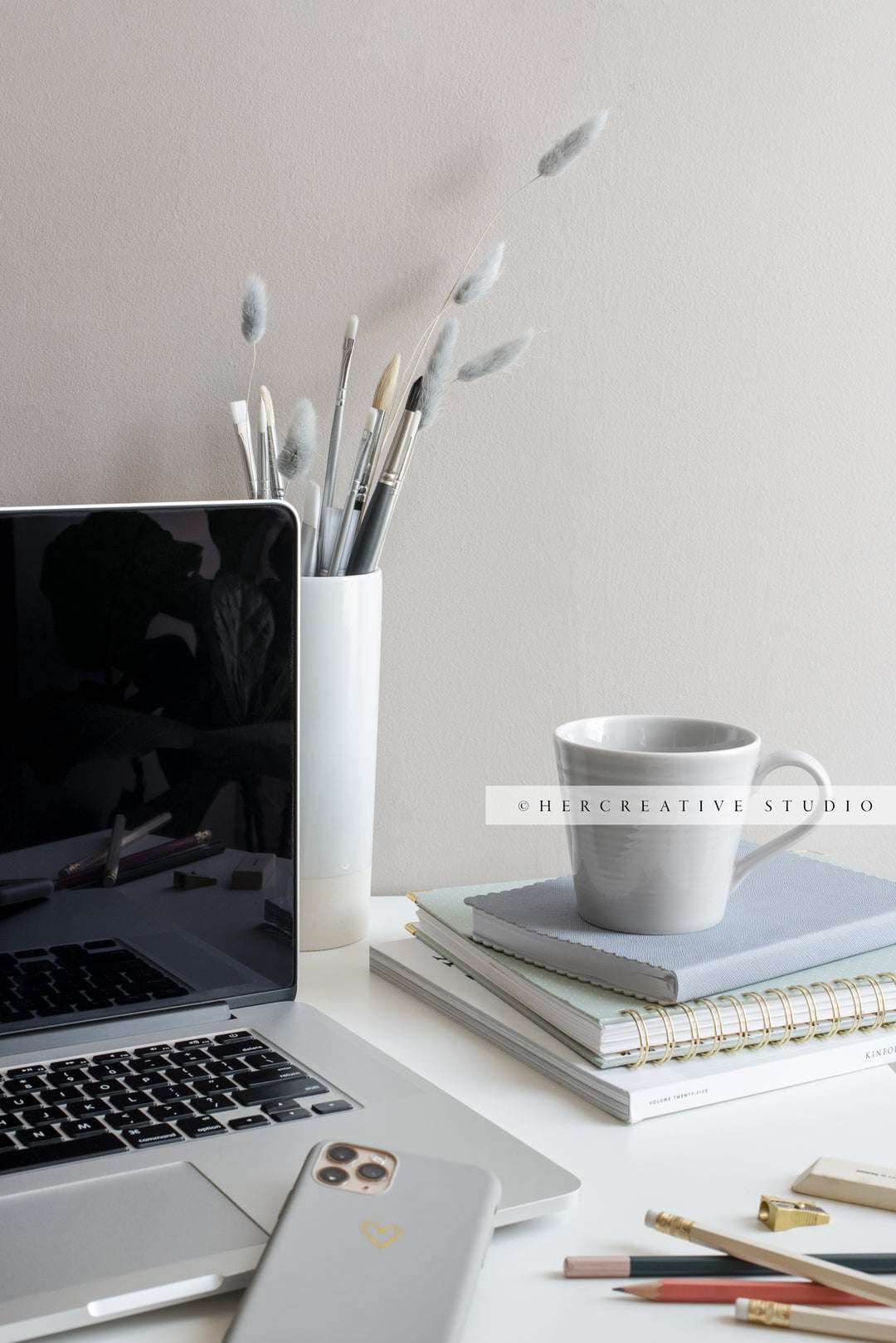 Laptop, Coffee and Paintbrushes on Grey Workspace. Stock Image