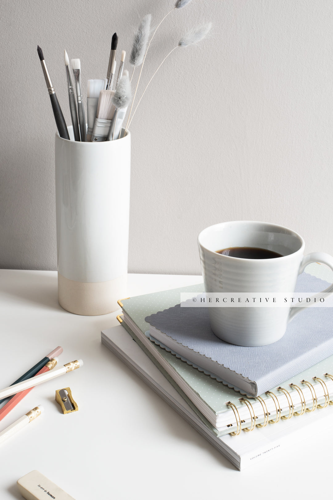 Coffee and Paintbrushes on Grey Workspace. Stock Image