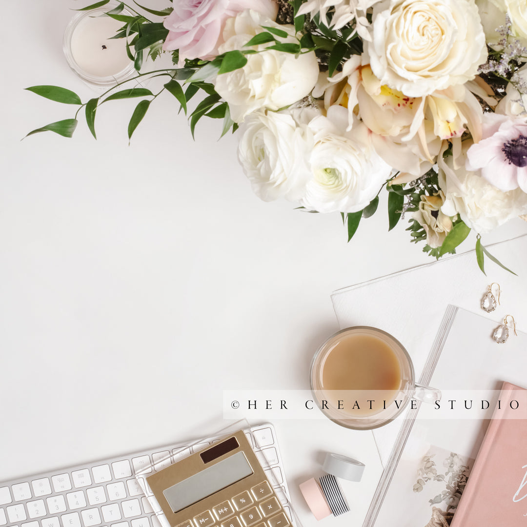 Coffee, Calculator & Flowers on Workspace, Styled Stock Image