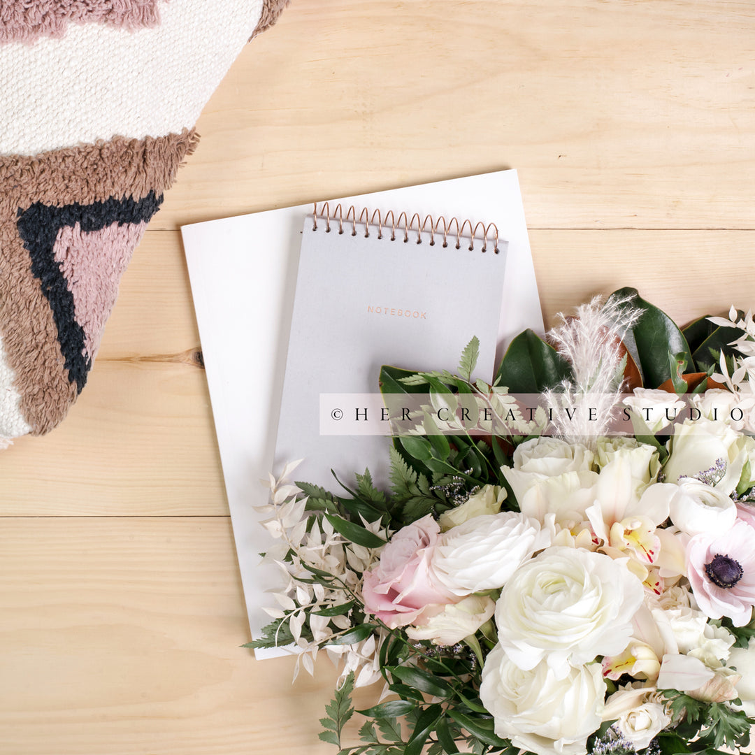 Flowers & Notebook on Wood Floor, Styled Stock Image