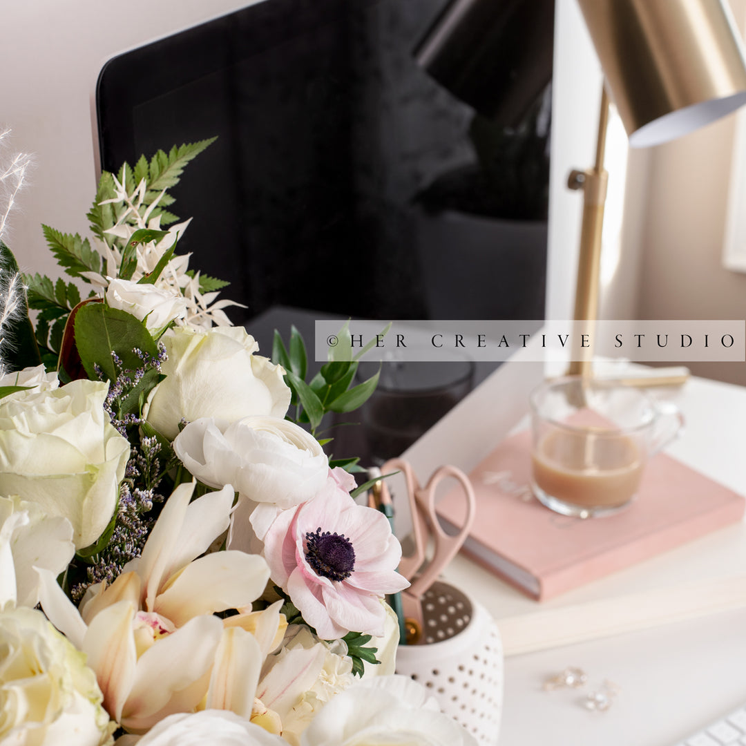 Flowers & Gold Lamp on Workspace, Styled Stock Image