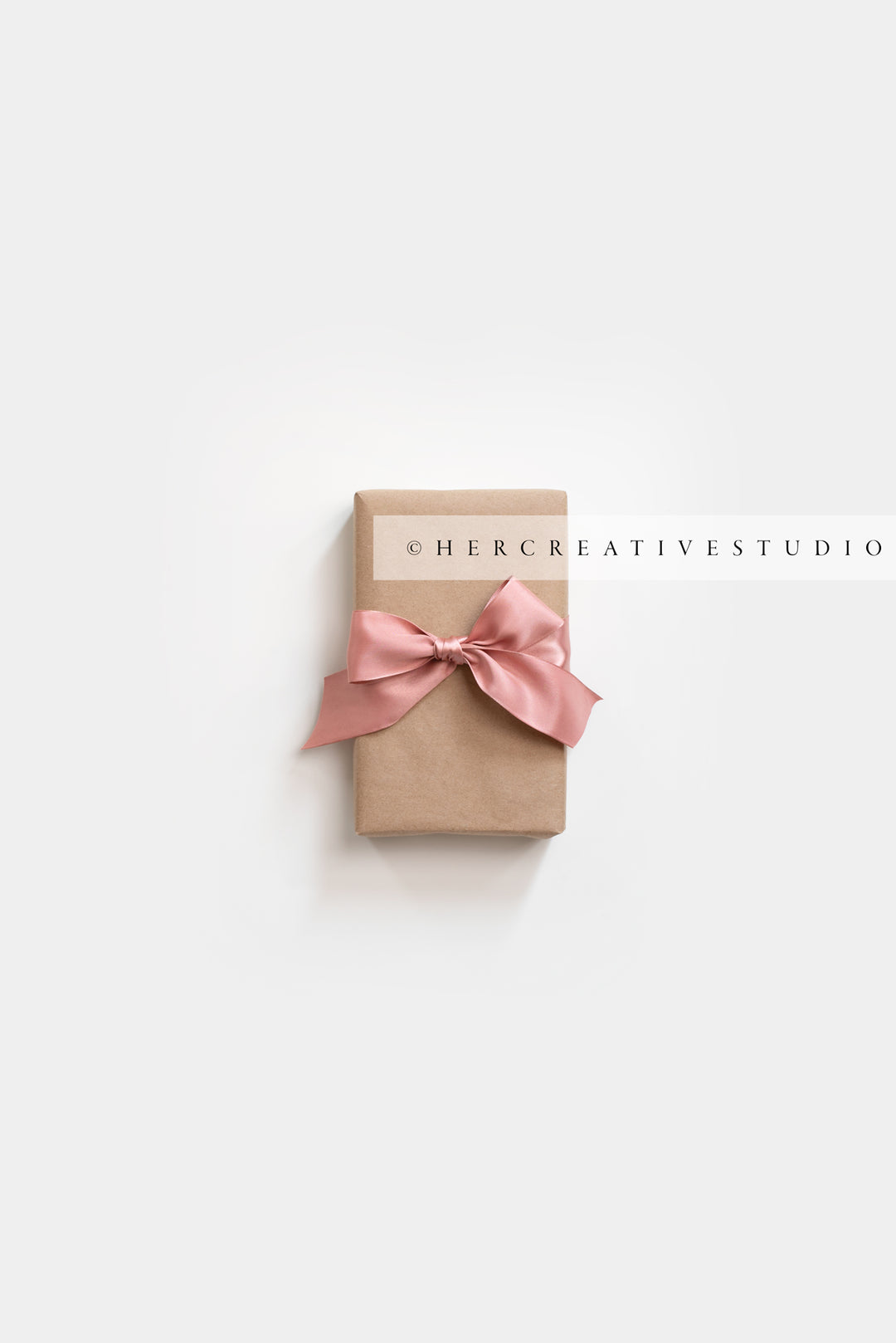Kraft Paper Gift with Pink Ribbon, Stock Image