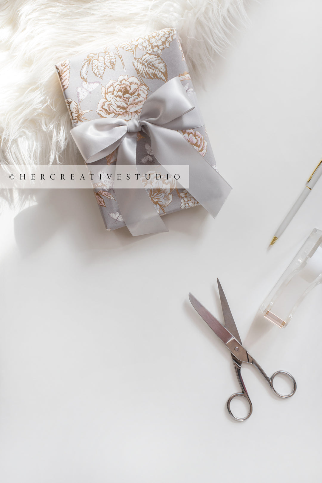 Grey Gift with Ribbon & Scissors in Sunlight, Stock Image