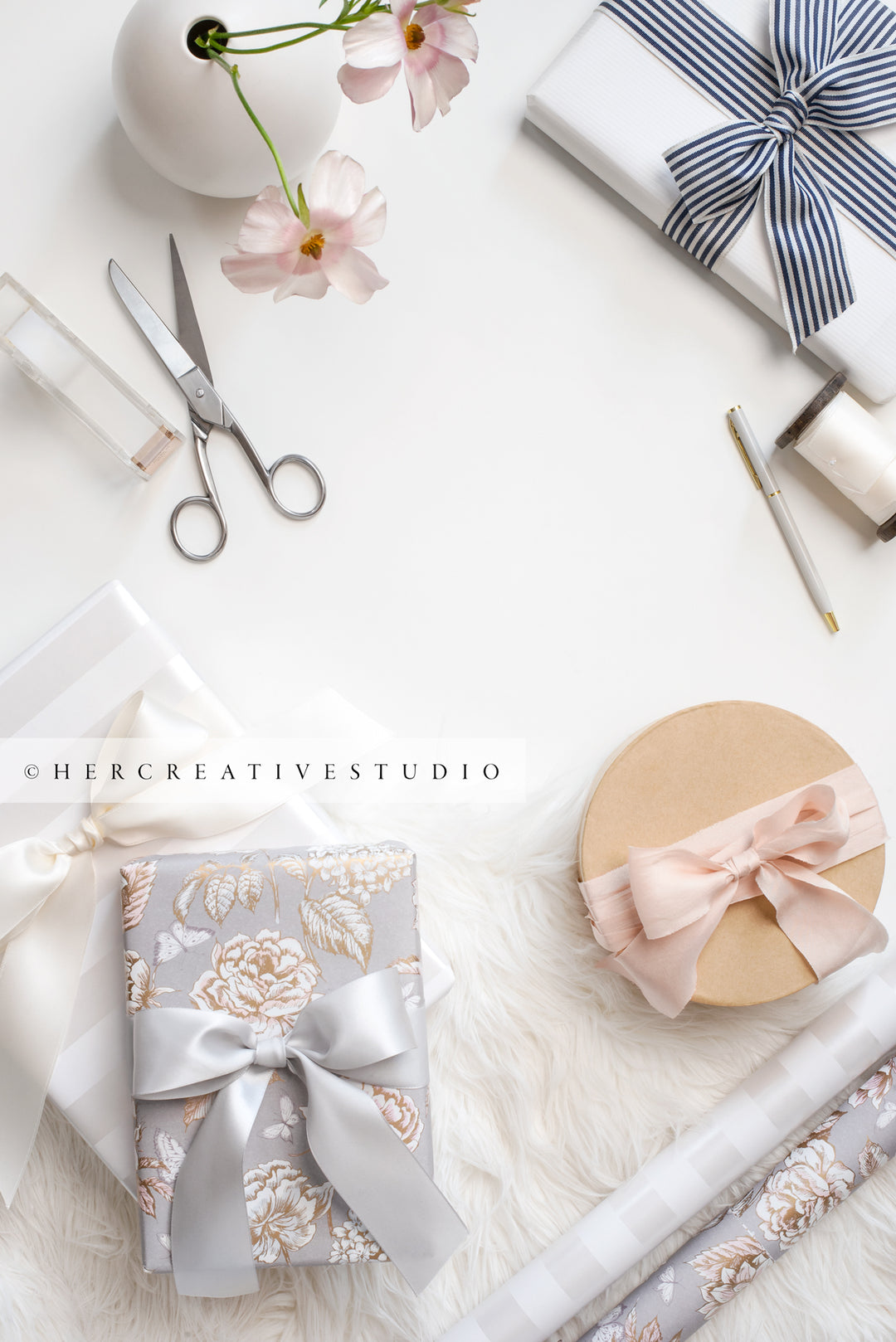 Gifts, Ribbon & Flowers on White Background. Stock Image