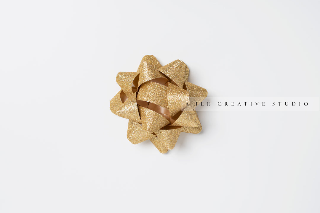 Gold Holiday Bow on White Background