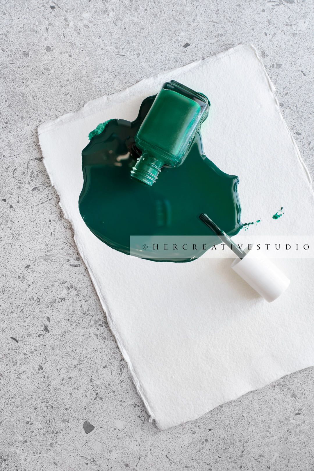 Green Nailpolish Spilled on Table. Styled Stock Image
