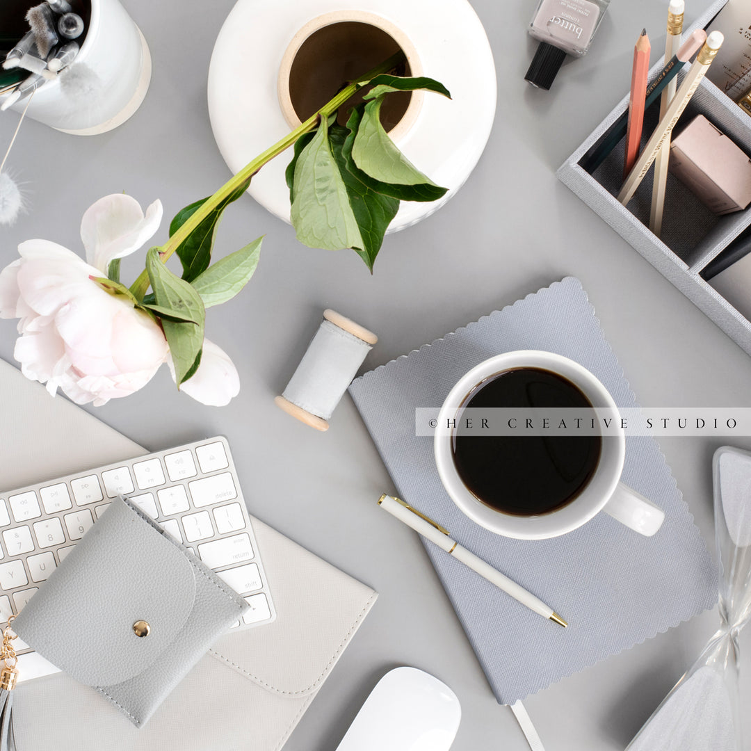Coffee and Peony on Grey Workspace. Stock Image