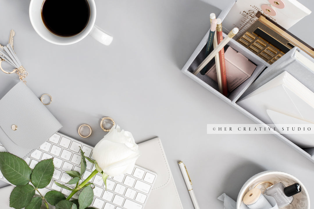 Rose & Coffee on Grey Workspace. Stock Image