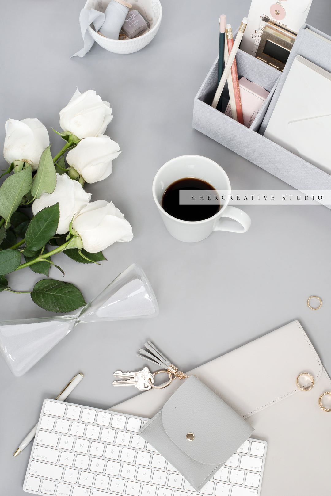 Roses, Hourglass & Keychain on Grey Background. Stock Image