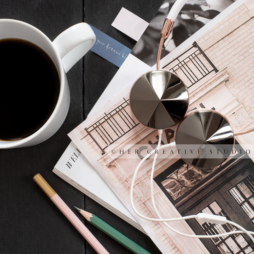 Paperwork, Headphones & Coffee on Black Desk