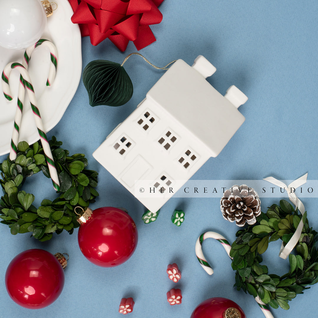 Holiday Home & Candy Cane Flatlay on Sky Blue Background
