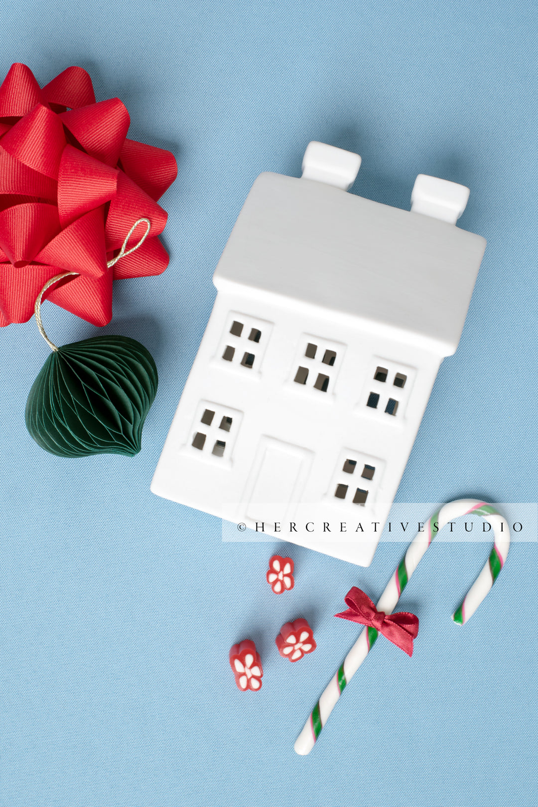 Holiday Home, Red Bow & Wreath on Sky Blue Background