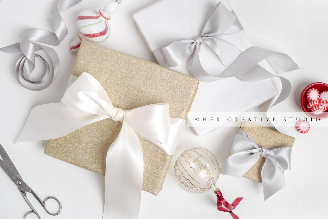 Gold & White Holiday Presents with Trimmings on White Background