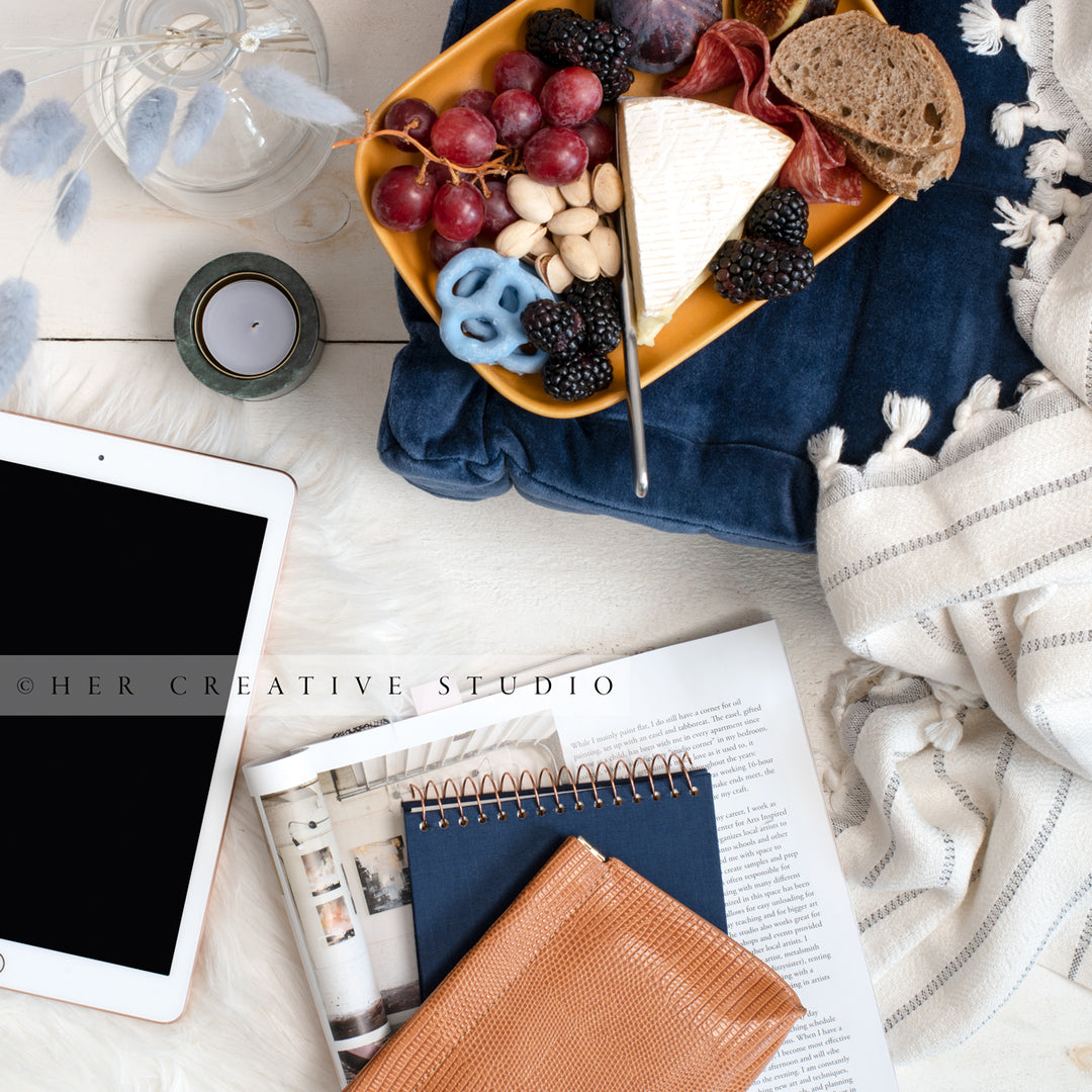 Workspace with Cheese Plate, Tablet & Notebook