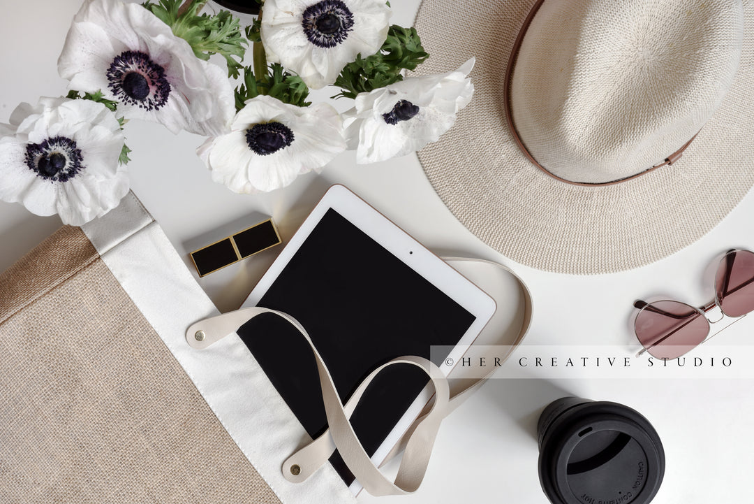 Panama Hat, Tote, Tablet with Coffee. Styled Image.
