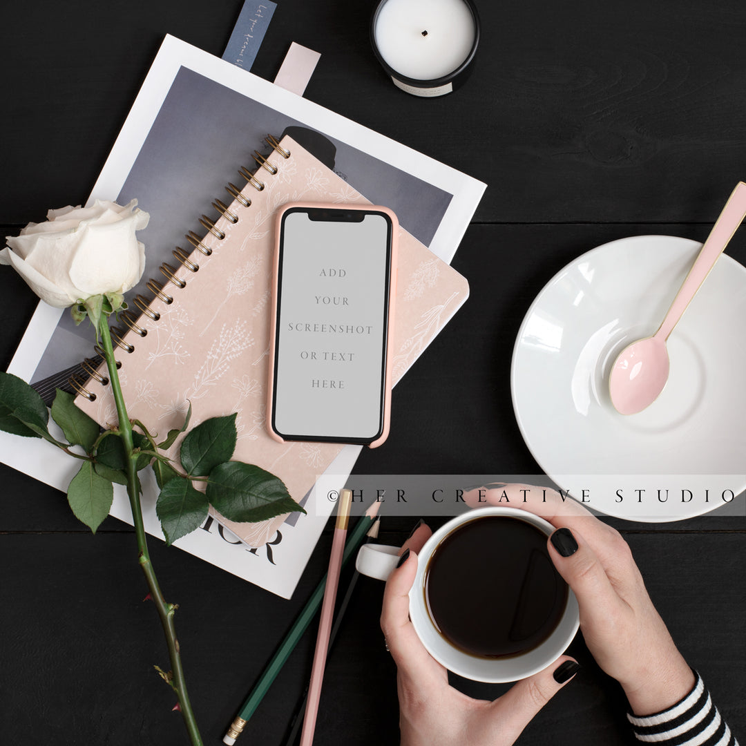 Woman Holding Coffee with Smartphone on Black Desk