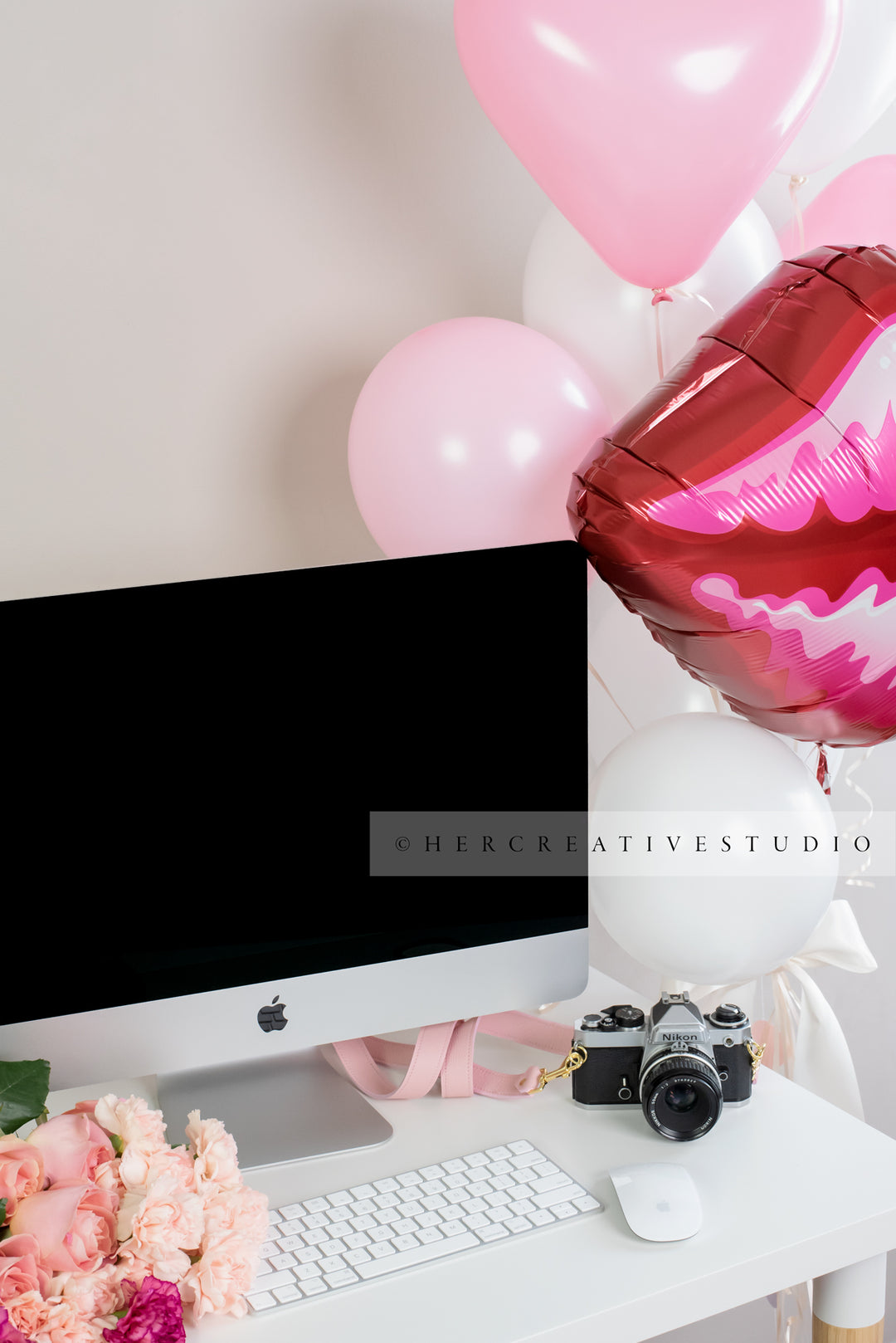 Balloons on Computer Desk, Styled Stock Image
