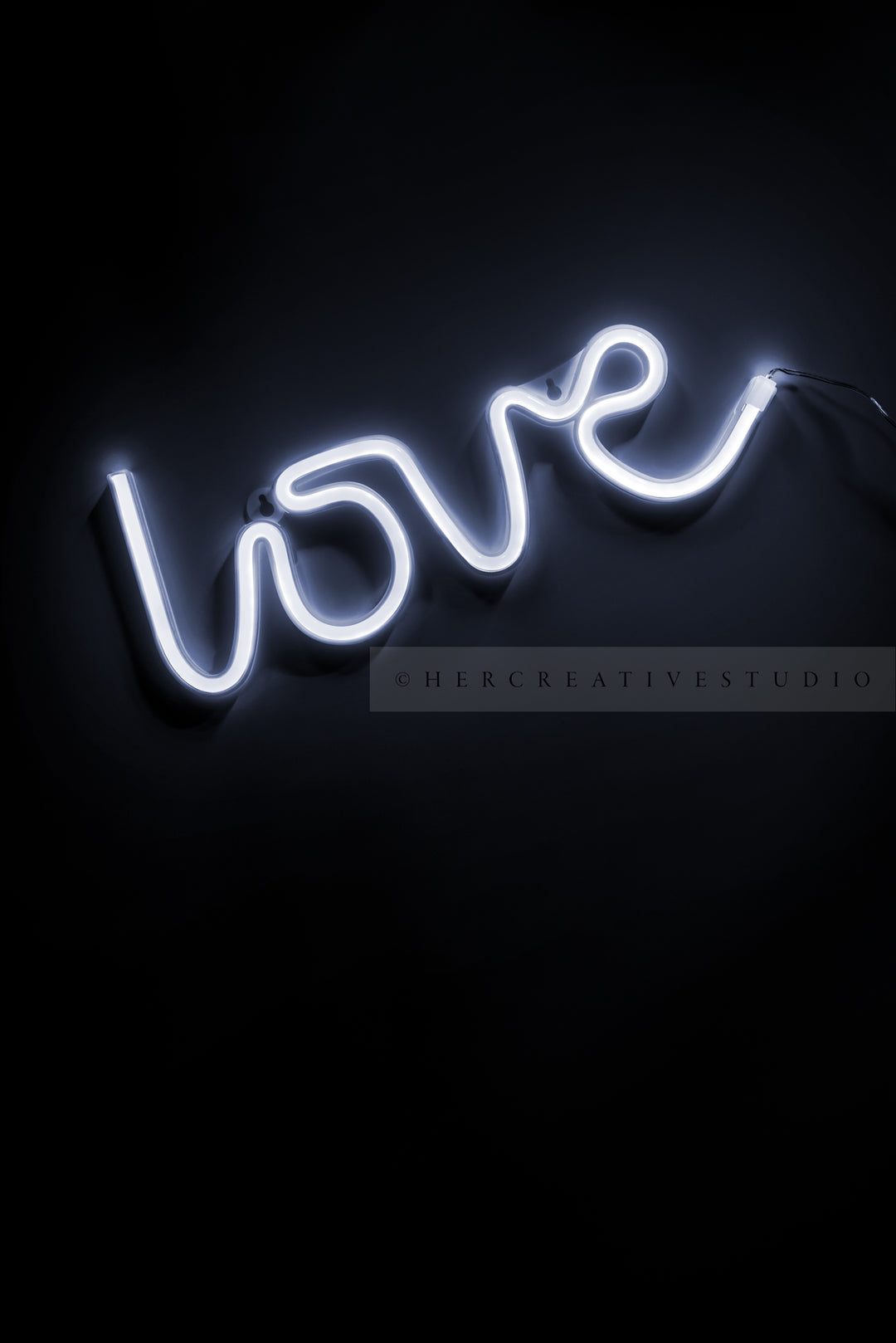 Neon White 'Love' Black background, Styled Stock Image