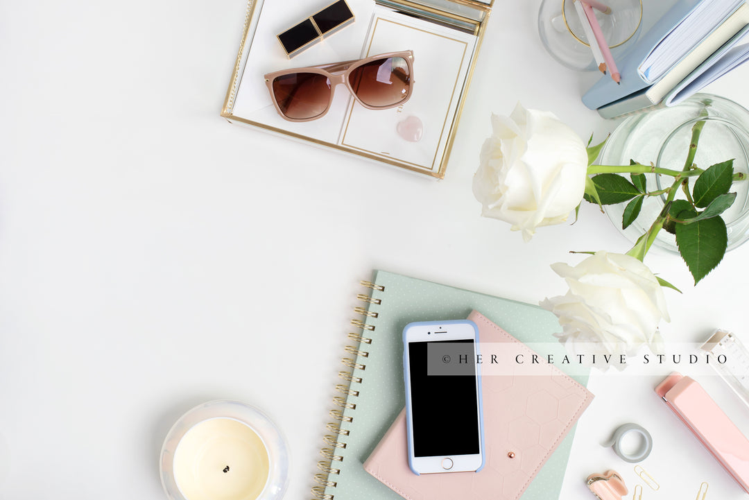 Notebooks, Sunglasses and Candle Flatlay