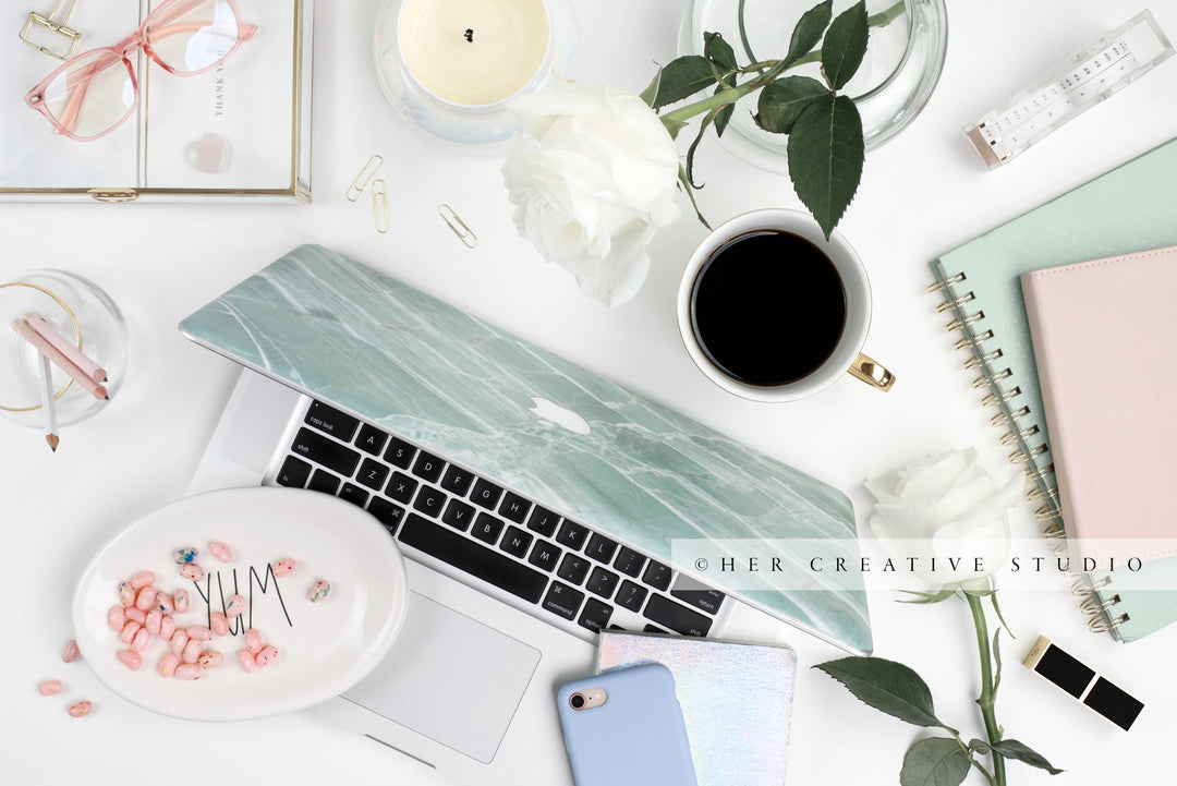 Candy Dish, Coffee and Laptop Flatlay. Stock Photo.