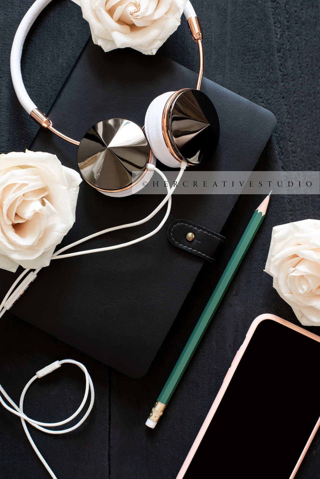 Headphones, Smartphone & Roses on Black Desk