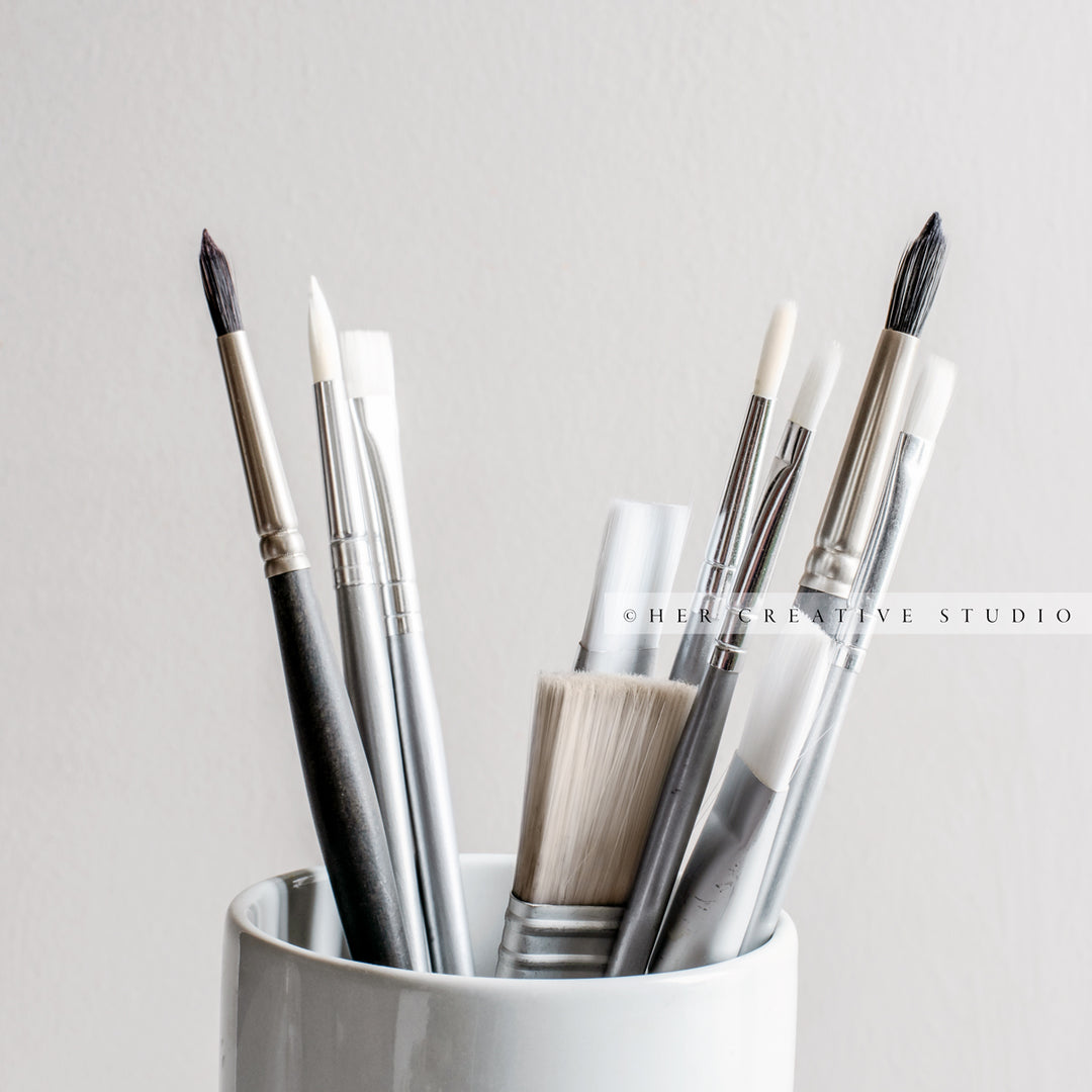 Paintbrushes on Grey Background. Stock Image