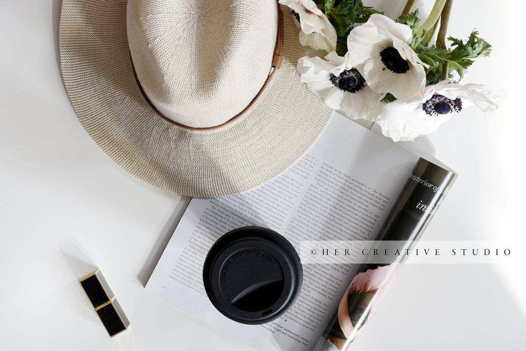 Panama Hat, Anemone with Coffee in Sunlight. Styled Image.