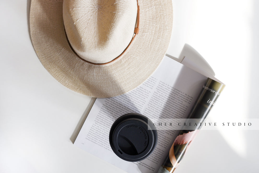 Panama Hat with Coffee in Sunlight. Styled Image.