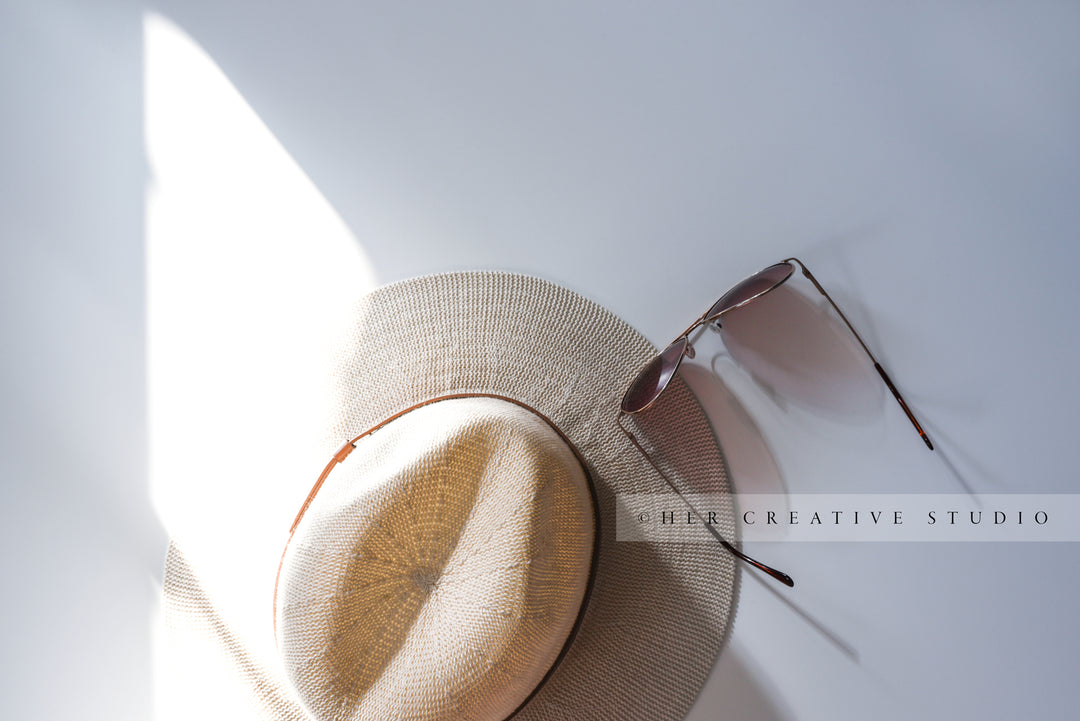 Panama Hat with Sunglasses in Sunlight. Styled Image.