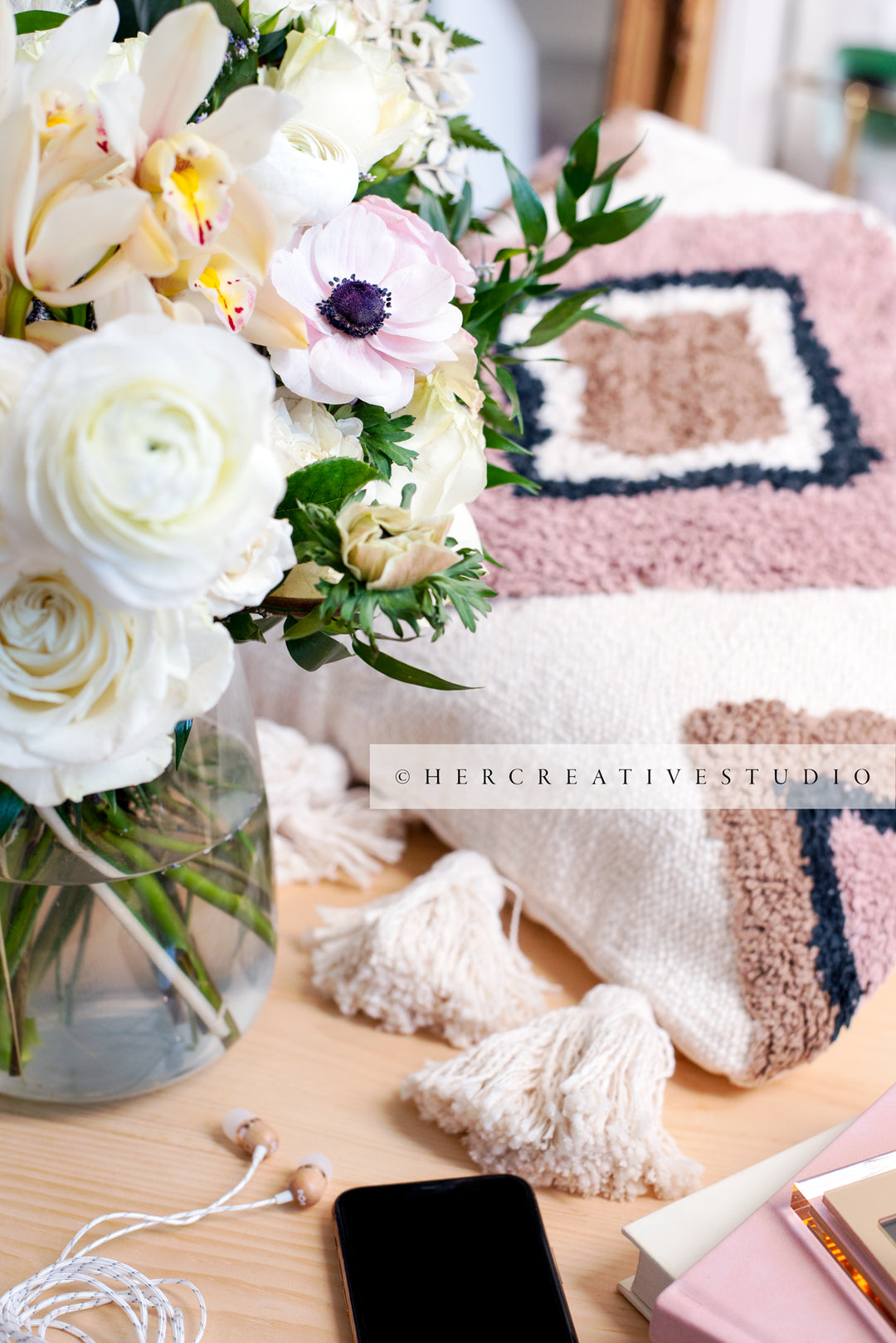 Cushion & Flowers on Wood Floor, Styled Stock Image