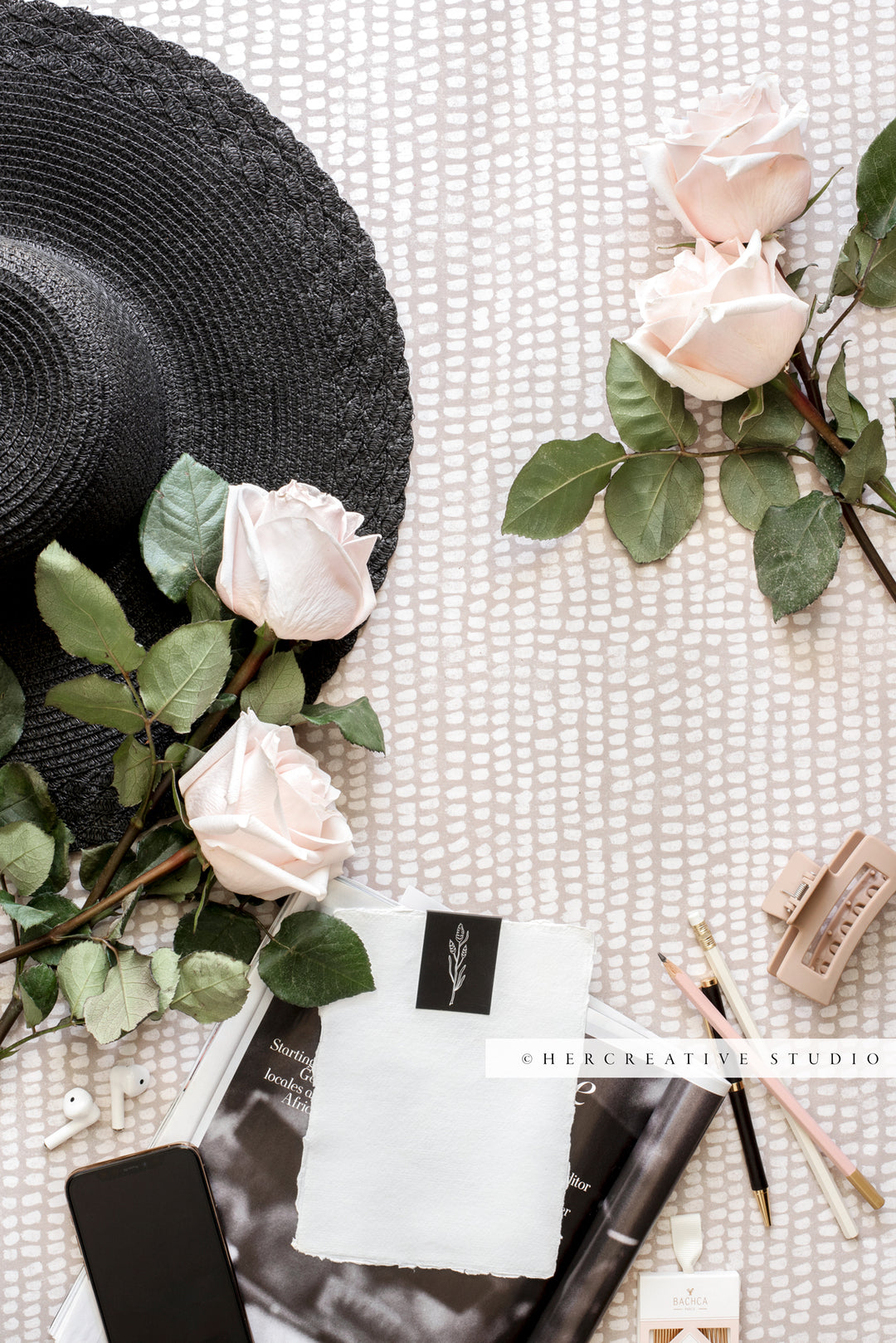 Roses, Black Hat & Notepaper in Sunshine, Stock Image