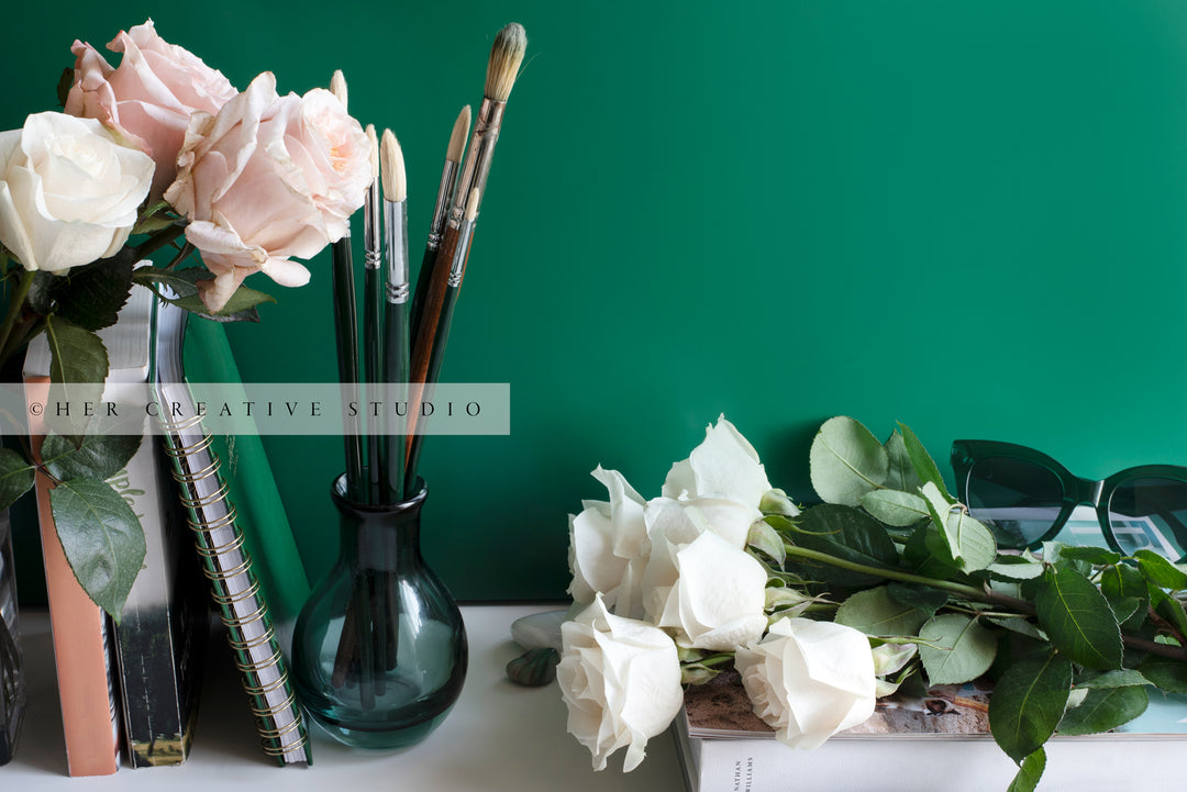 Paintbrushes & Roses on Desk. Digital Stock Image