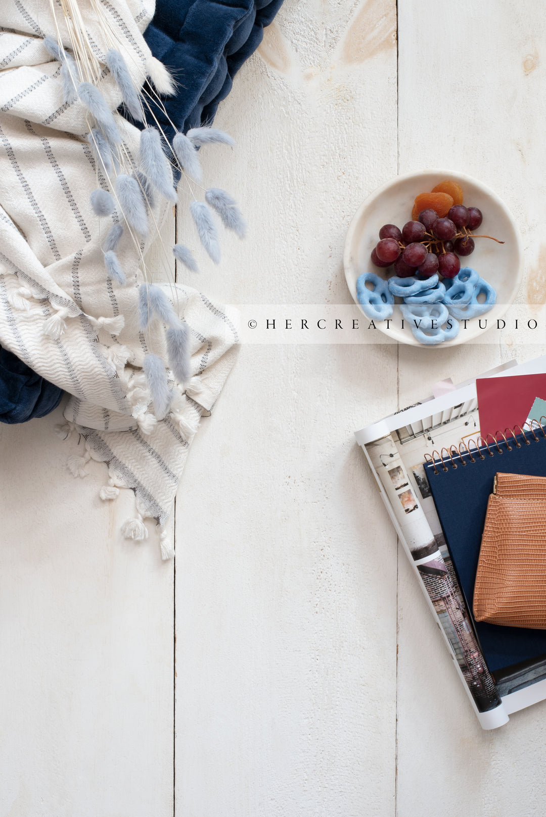 Bunny Tail, Notebook & Grapes on Wood Background