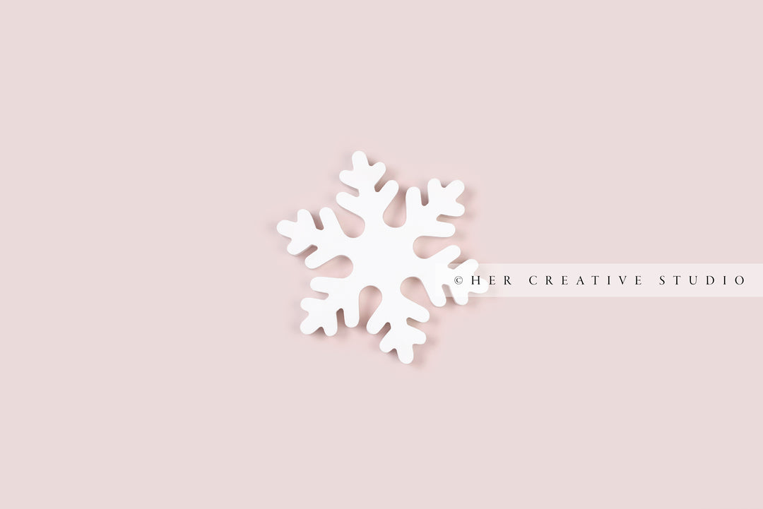 White Snowflake on Pink Background, Stock image