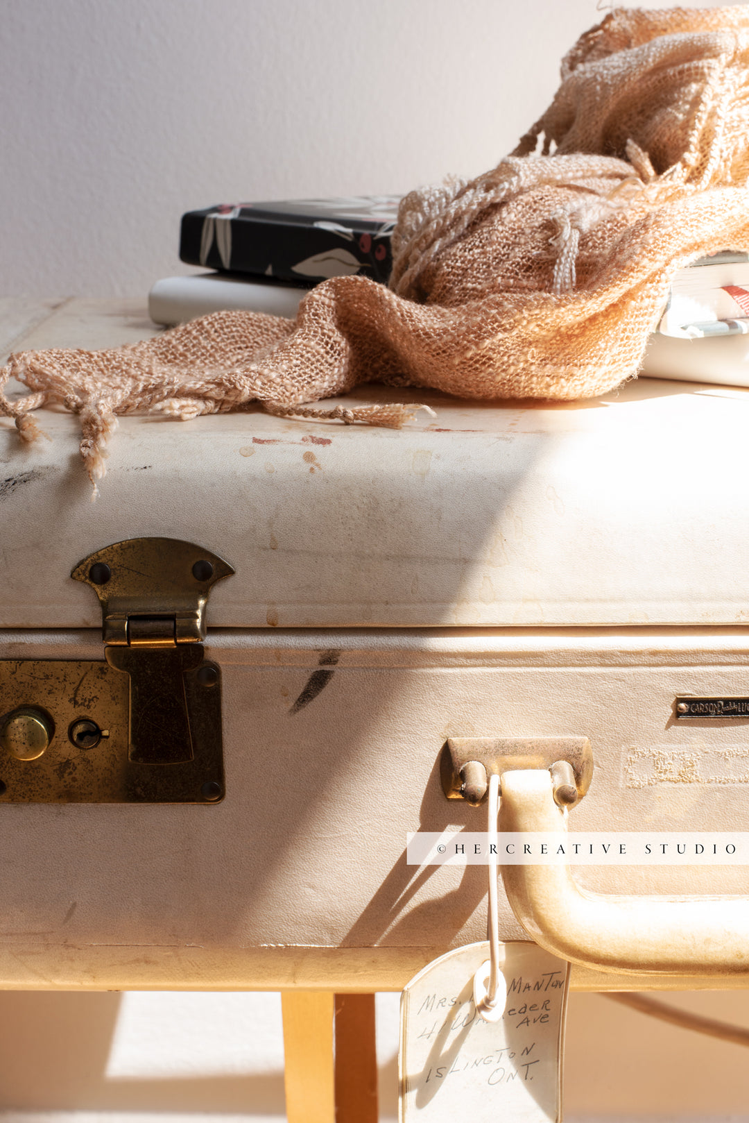 Peach Scarf on Vintage Suitcase in Sunshine, Stock Image