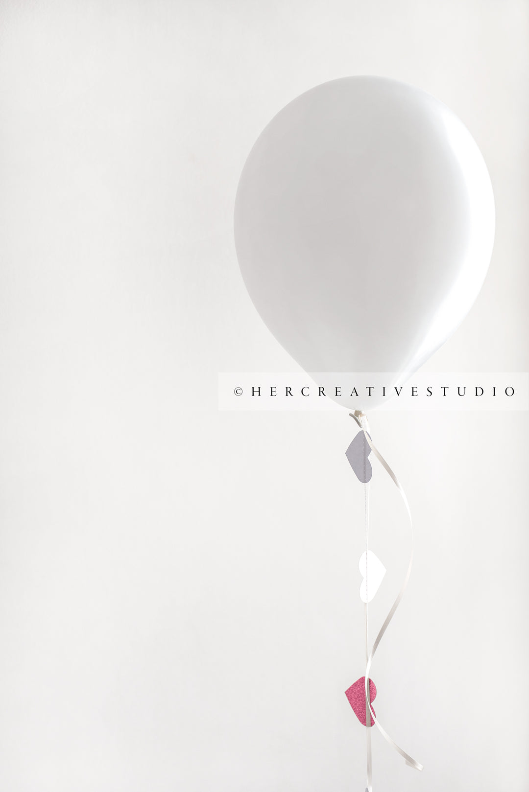 White Balloon with Heart Ribbon, Styled Stock Image