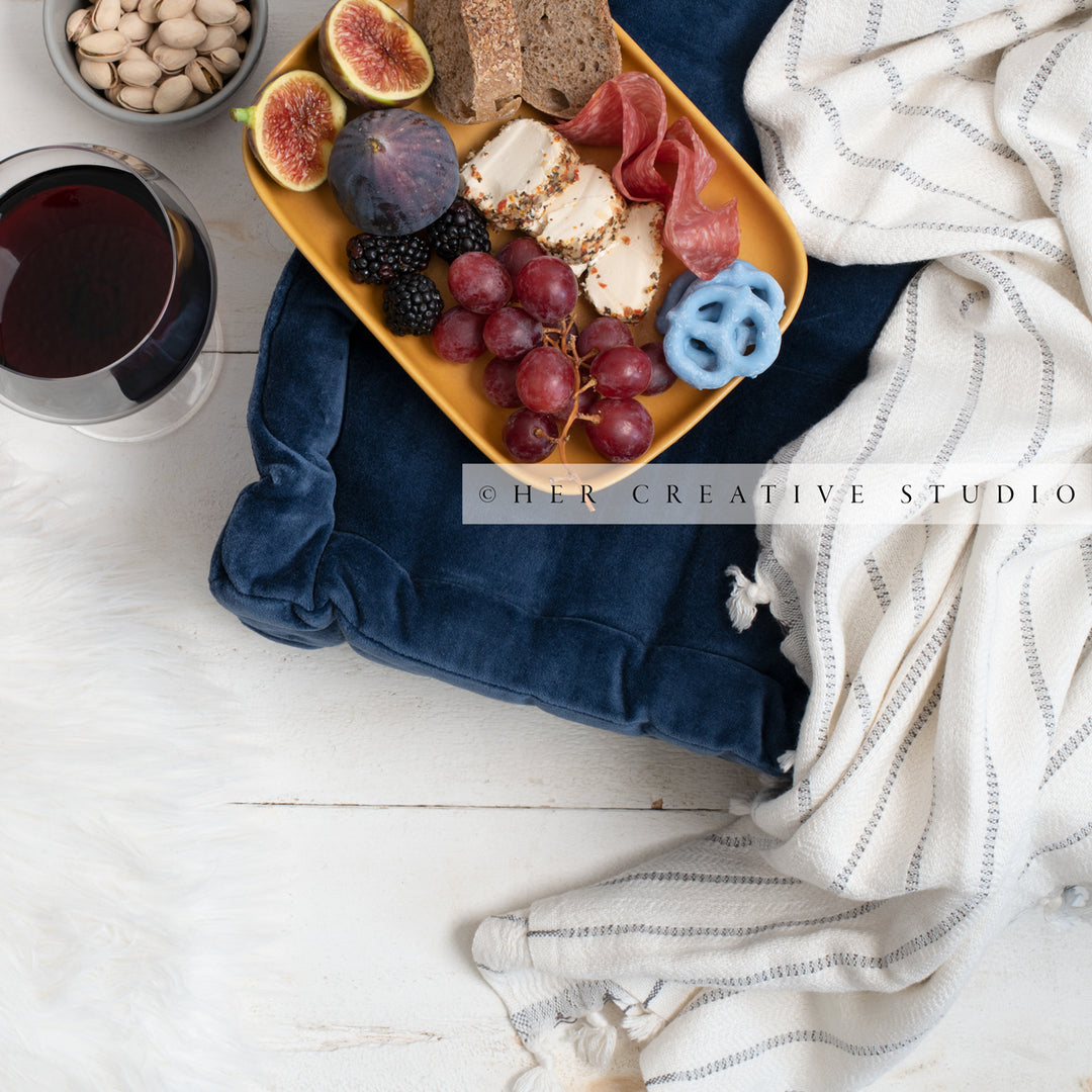 Cheese Plate, Red Wine & Floor Cushion, Styled Image