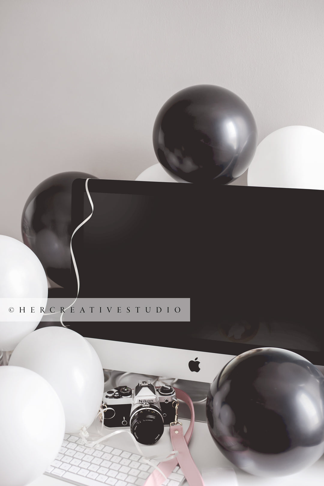 Black Balloons on Workspace, Styled Stock Image