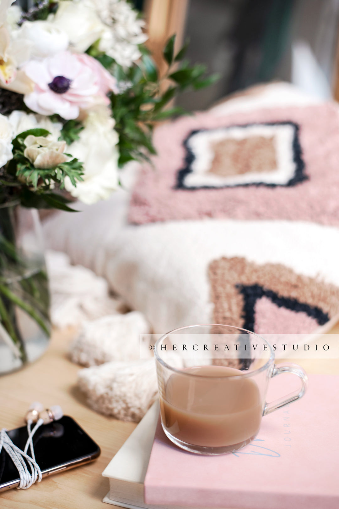 Coffee, Cushion & Flowers on Wood Floor, Styled Stock Image