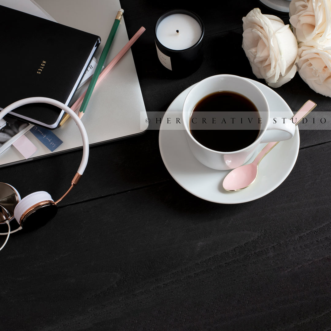 Coffee on Black Desk with Desk Accessories